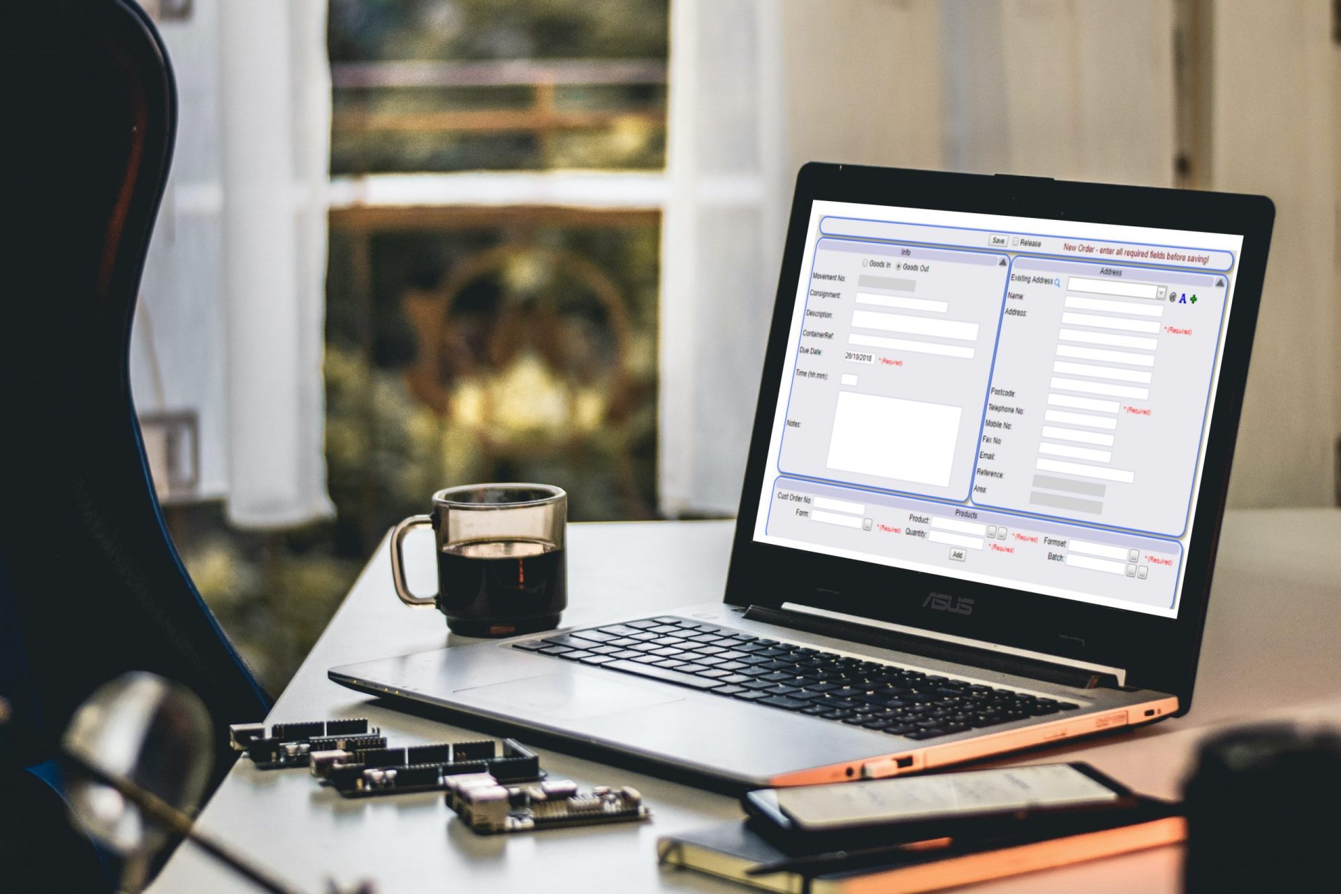 Warehouse Management System on a laptop screen